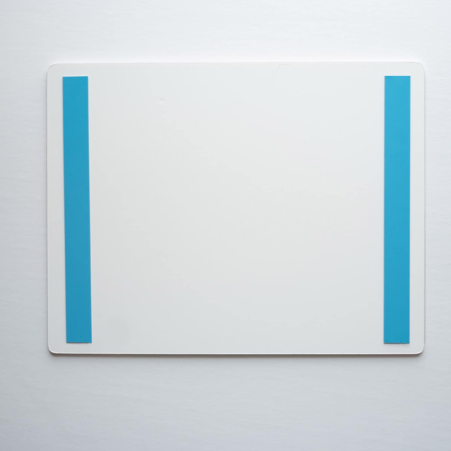 Double-sided VHB mounting tape applied to the back of an evacuation map sign
