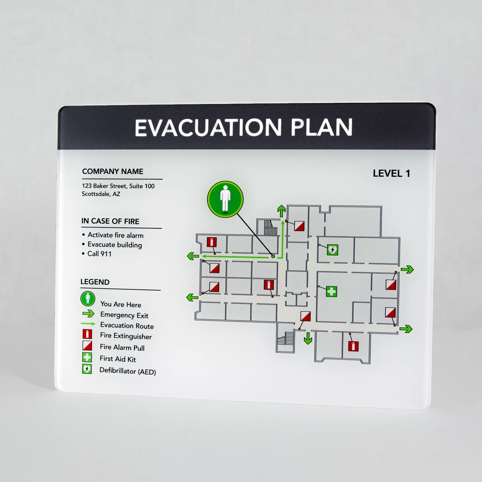 Standard acrylic evacuation plan full view showing level 1 floor layout with fire safety icons, AED locations, and emergency procedures